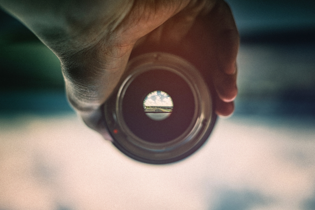 A camera lens displaying the world